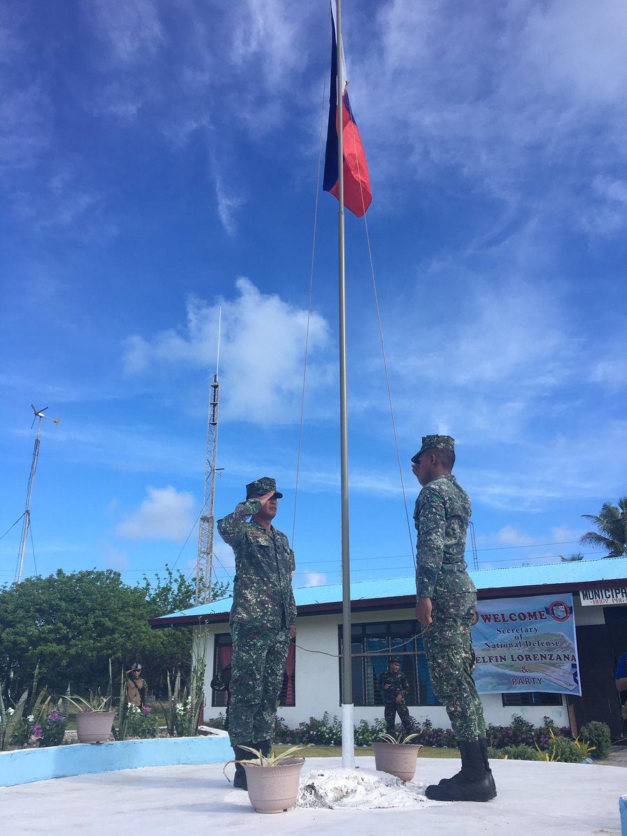FLAG-RAISING. A flag-raising ceremony is held upon the arrival of Philippine officials in Pag-asa. Photo by Carmela Fonbuena/Rappler 