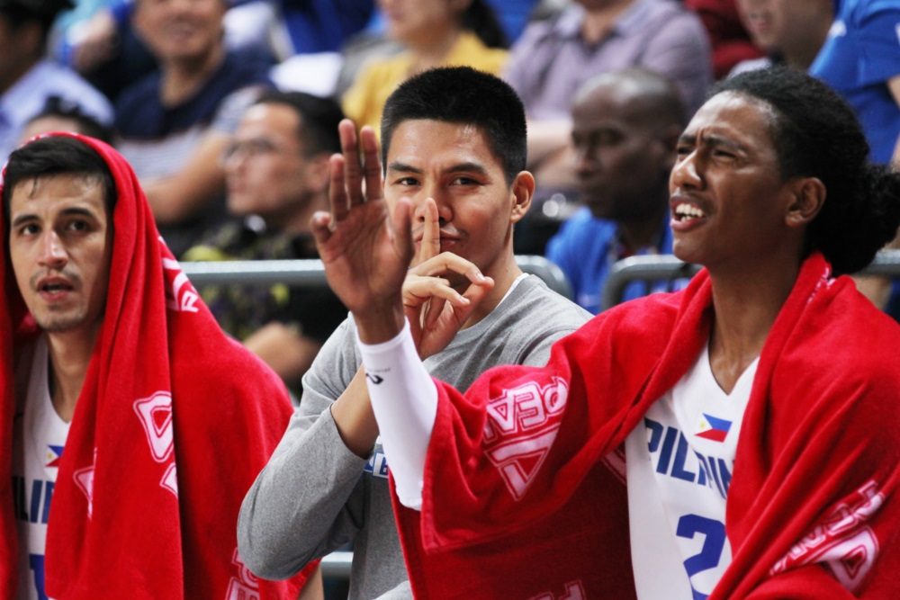 SSHH. JC Intal (center) tells the hostile crowd in China to quiet down. Andray Blatche also did the same gesture as he buried crucial free throws in the fourth quarter. Photo from FIBA 