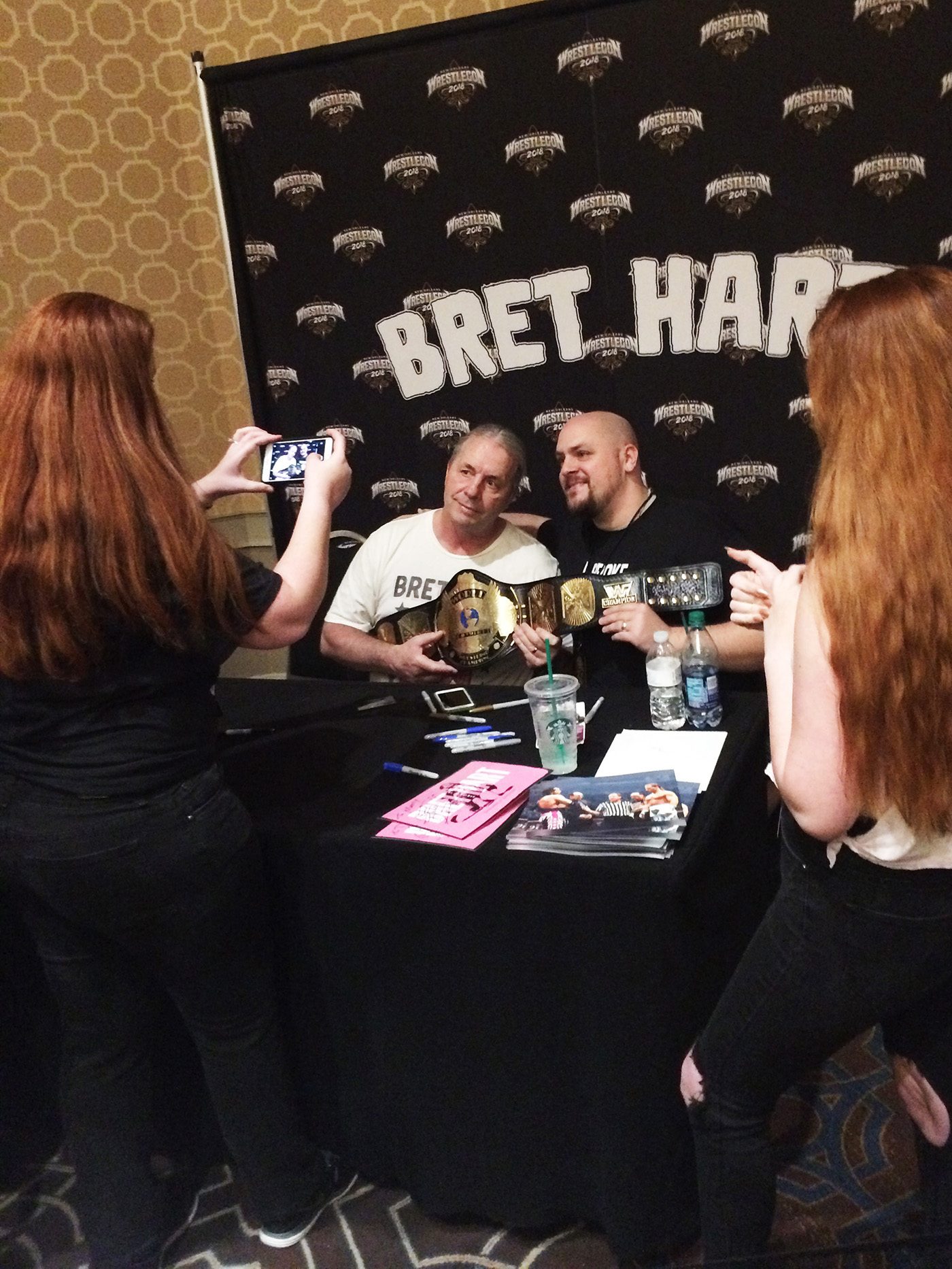 WWE hall of famer Bret Hart poses with a fan at Wrestlecon New Orleans. 