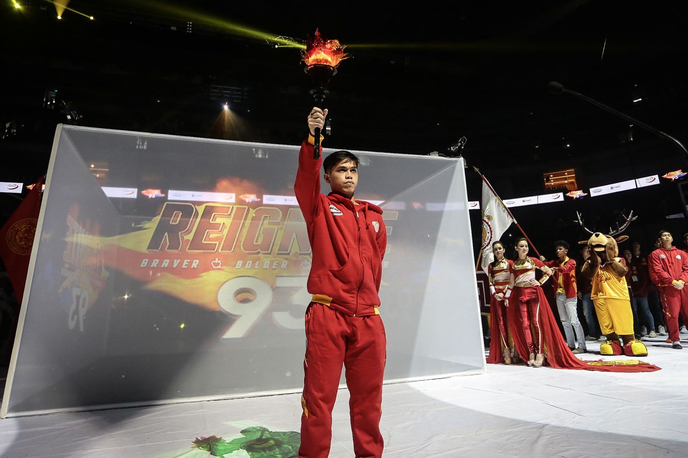 TORCH BEARER. Ryan Costelo holds the torch before the 10 participating teams in the tournament. Photo by Josh Albelda/Rappler  