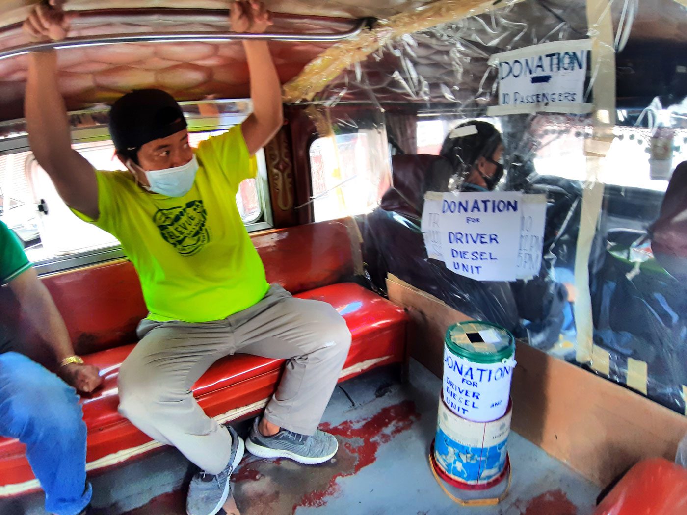 CHARITY. A jeepney driver of Trancoville, Baguio City placed a donation box inside his jeepney.  Photo by Mau Victa/Rappler 