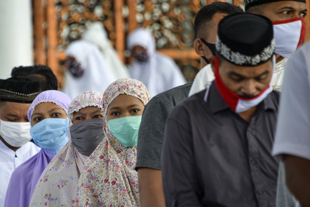Virus lockdowns stifle Eid celebrations as infections rise