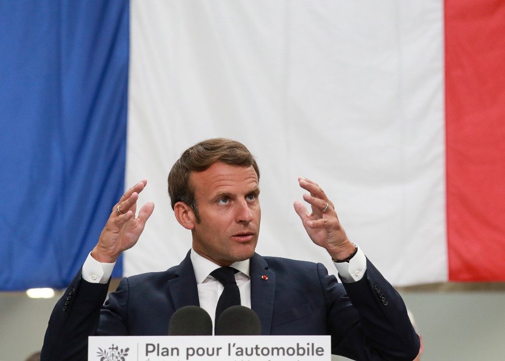 Macron unveils 8-billion-euro French auto rescue, champions electric cars