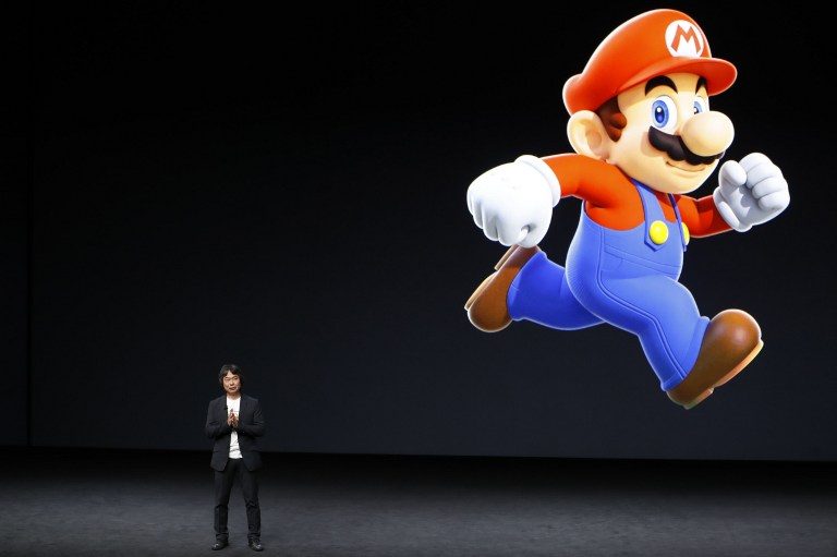 ICONS. Japanese game developer Shigeru Miyamoto and his brainchild Super Mario have made the jump to iOS – a surprising move given their parent company Nintendo's tradition of exclusivity. Photo by Stephen Lam/AFP 
