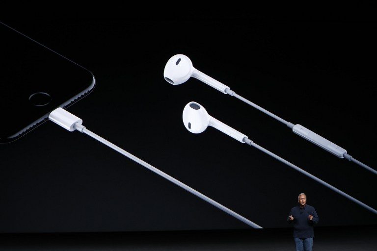 NEW INTERFACE. Apple Senior Vice President of Worldwide Marketing Phil Schiller suggests that analog connectors have become incongruous with the Apple ecosystem, necessitating the Lightning earphones. Photo by Stephen Lam/AFP 