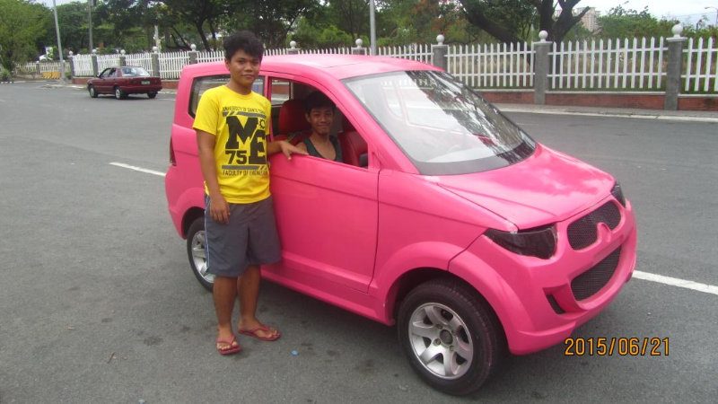 PRETTY IN PINK. Lagangan's sons pose with their father's creation. Photo from Adonis Lagangan 