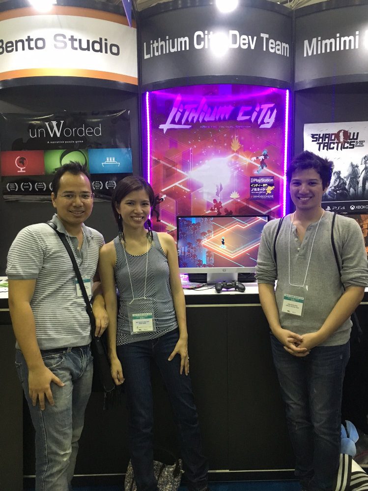 SONY SHOWCASE. Lithium City was picked for the PlayStation manufacturer's independent games exhibit. On the left is the game's developer Nico Tuason, joined by his wife and brother. Photo by Terry de Guia Tuason   