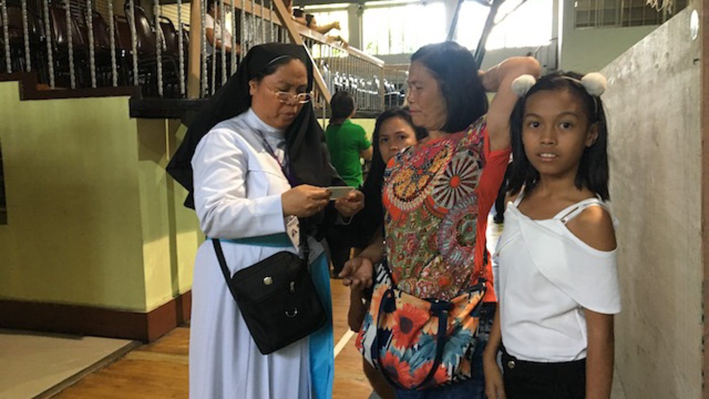 WATCHDOGS. Nuns at the school assist voters. Photo by Carmela Fonbuena/Rappler 
