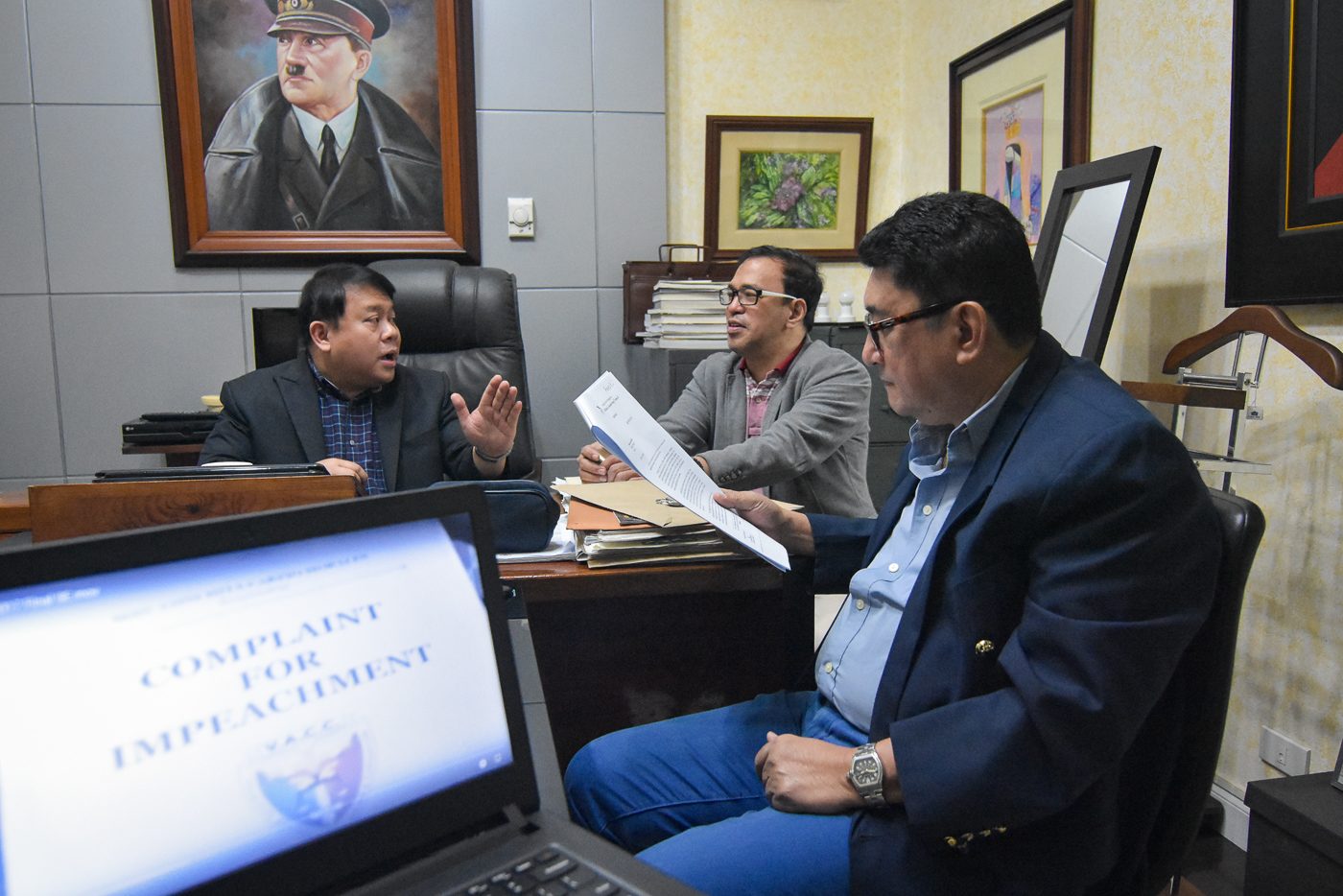 COMPLAINT VS OMBUDSMAN. Ferdinand Topacio, Manny Luna and Jing Paras in a huddle inside the Topacio Law office on October 27, 2017, on the impeachment complaint by the VACC against Ombudsman Conchita Carpio-Morales. Photo by LeAnne Jazul/Rappler 