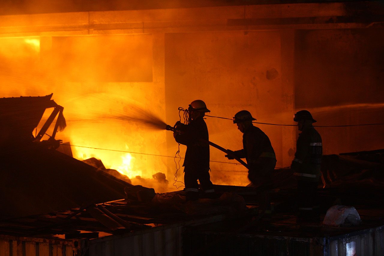 BATTLING A BLAZE. Firefighters battle a raging fire at a warehouse of the Bureau of Customs in Port Area, Manila in the evening of June 1, 2017. Photo by Ben Nabong/Rappler  