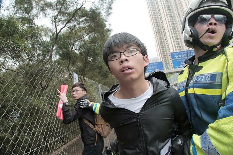 Hong Kong protesters detained after bid to stop China official