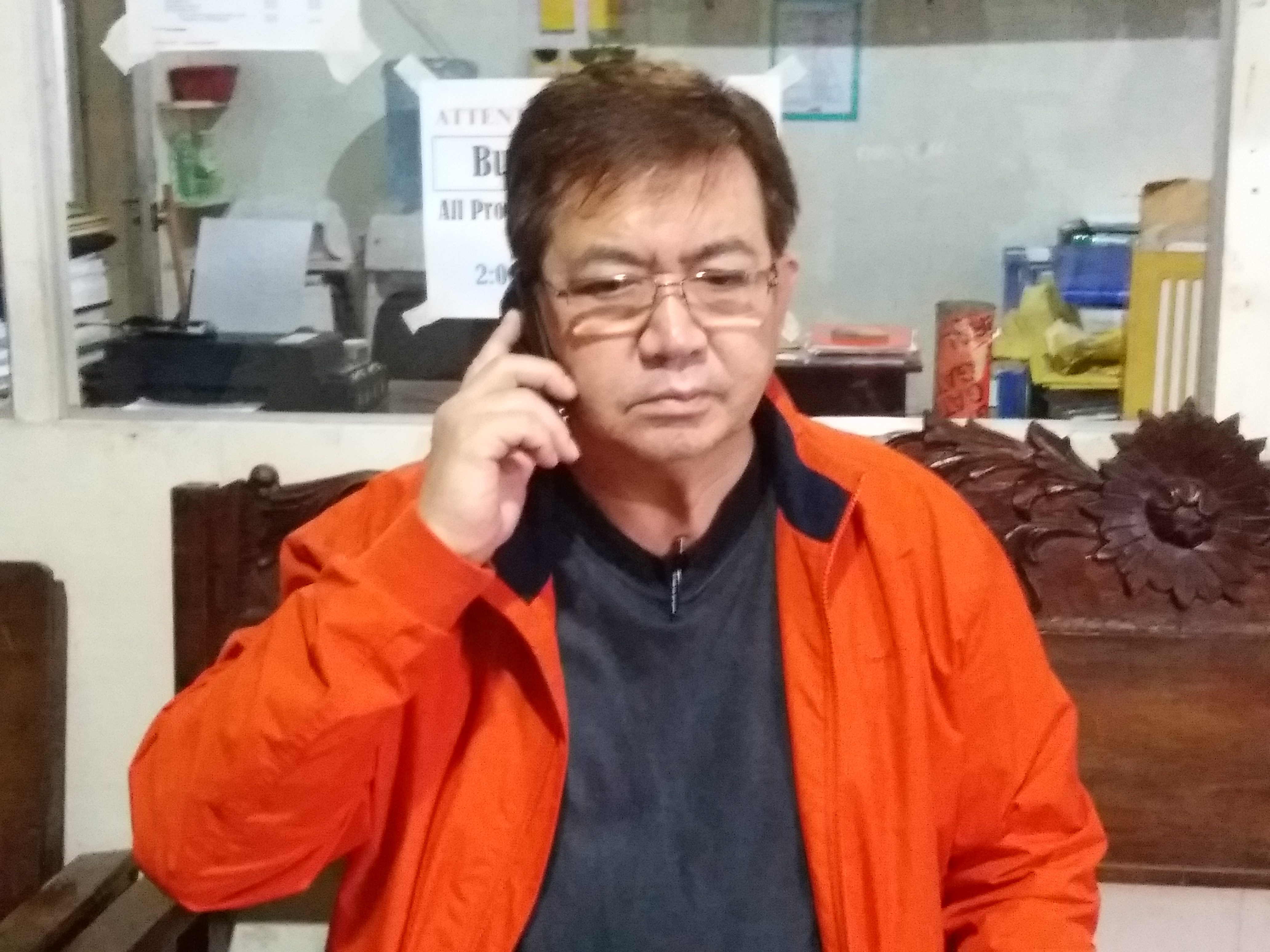 ATTACKS. An angry San Jorge Mayor Joseph Grey talks to authorities over the phone shortly after the attack on his homes and warehouse on January 31, 2017. Photo by Jazmin Bonifacio/Rappler  