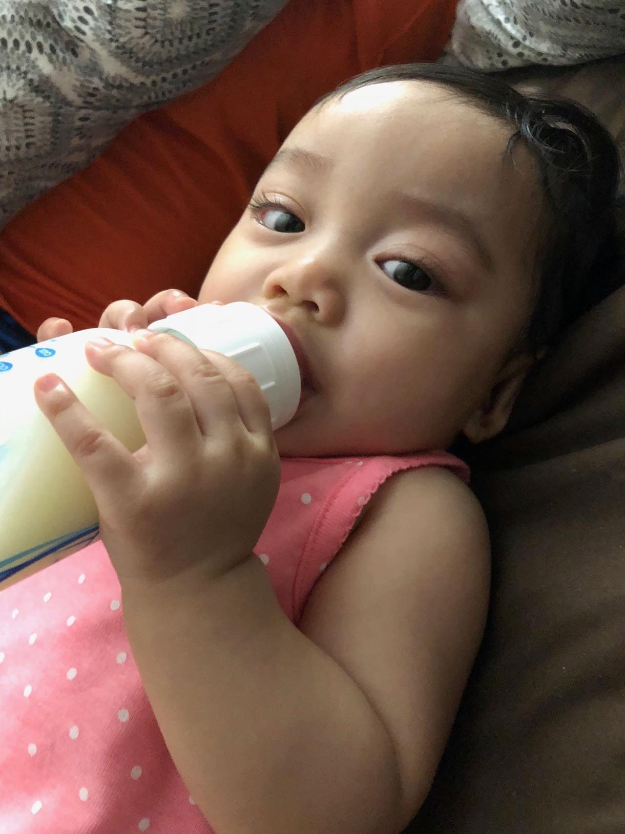 Raya uses a regular bottle with breast milk when Ana is not around to feed her 