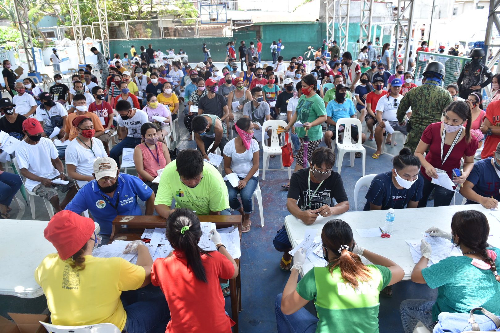 CAVITE. Residents of Barangay Pasong Camachile 1 in General Trias City crowd on Thursday, May 7, 2020 to receive their cash aid from the government's emergency subsidy program. Photo by Dennis Abrina 