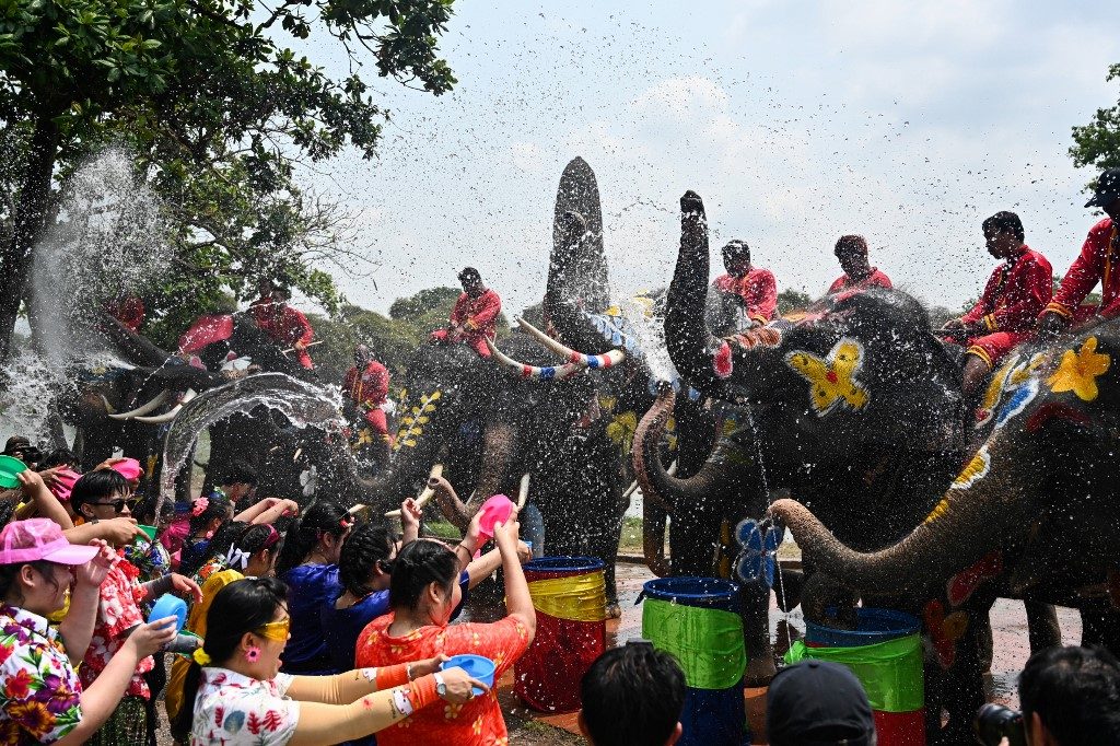 Water battles with elephants kick off Thai New Year