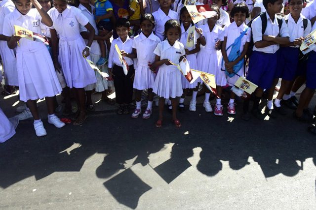 WELCOME COMMITTEE. Sri Lankan children wait for the arrival of Pope Francis in Colombo on January 13, 2015. Photo by Munir uz Zaman/AFP