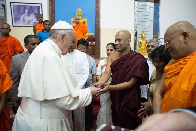 SURPRISE STOP. Pope Francis visits the Agrashravaka Buddhist Temple in Colombo, Sri Lanka, 14 January 2015. Photo from Osservatore Romano/EPA