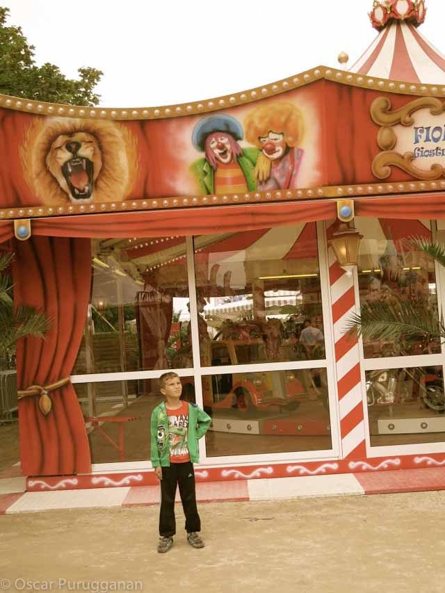 Boy in front of carousel. Jardin du Tuileries 