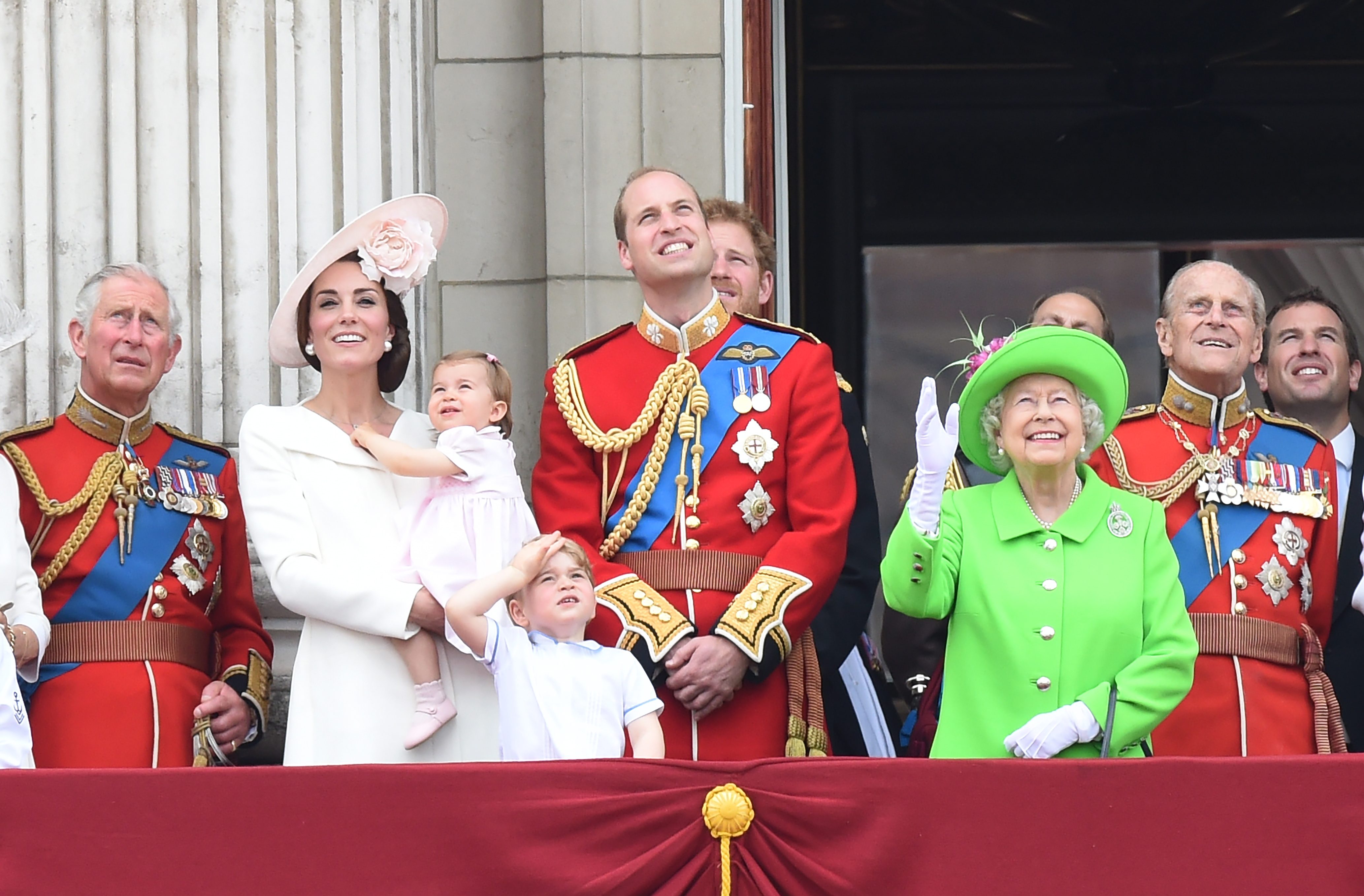 LOOK UP. (L-R) Britain's Charles, Prince of Wales, Catherine, The Duchess of Cambridge holding Princess Charlotte, Prince George, Prince William, Duke of Cambridge, Queen Elizabeth II, and Prince Philip, Duke of Edinburgh look up to the sky while standing in the balcony of Buckingham Palace during the Trooping of the Color parade in London, Britain, June 11, 2016. Photo by Facundo Arrizabalaga/EPA 