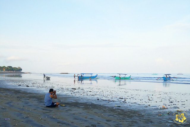 AT REST. Early morning low tide at Kuta beach  