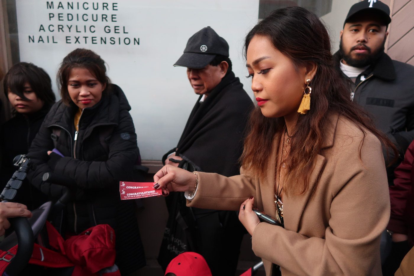 ONE OF THE FIRST 200. Francine Bailey shows the stubs saying she was among the first 200 customers in line. Photo by Stella Gonzales/Rappler 