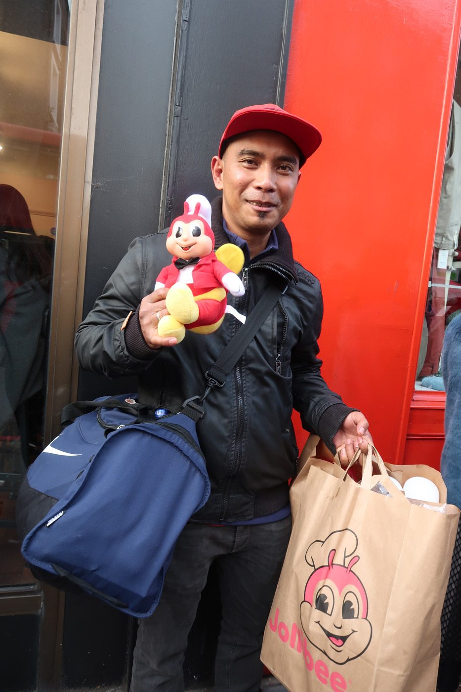 JOLLY OVER JOLLIBEE. Michael Sison proudly shows off his Jollibee loot. Photo by Stella Gonzales/Rappler  