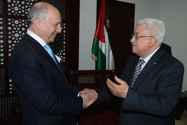 TALKING PEACE. A handout photograph supplied by the Palestinian Authority shows French Foreign Minister Laurent Fabius (L) as he is greeted by Palestinian President Mahmoud Abbas (R), in the 'Muqata' or Palestinian Authority headquarters, in the West Bank town of Ramallah, June 21, 2015. Thaer Ganaim/EPA 