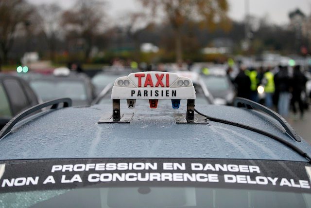 French cabbies angry at Uber block Paris airports, train stations