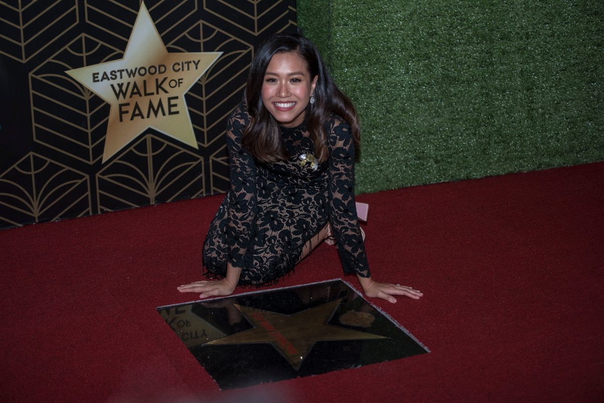Rachelle Ann Go poses next to her star at Eastwood. 