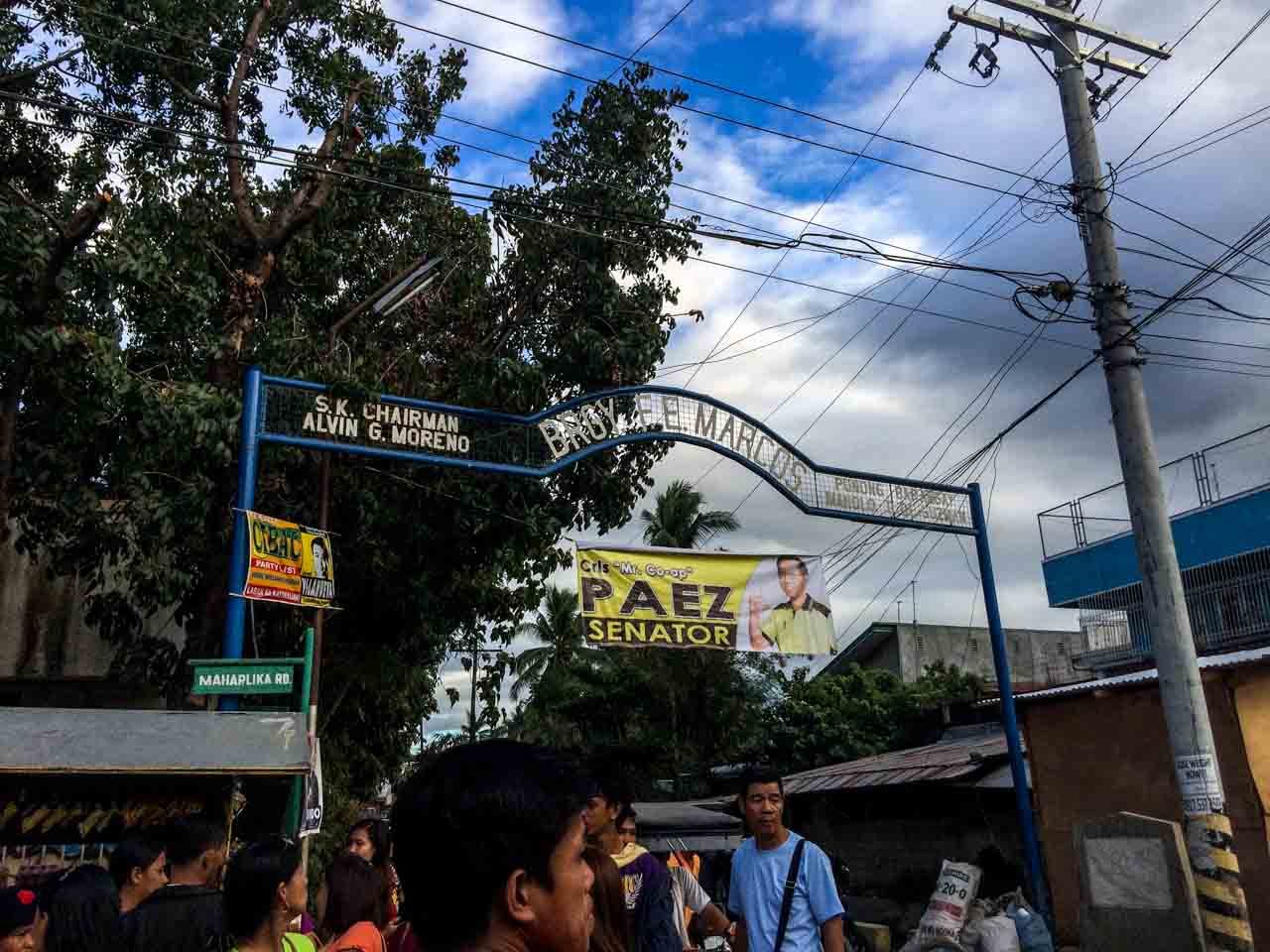 In FE Marcos village, Aquino hits martial law, Binay