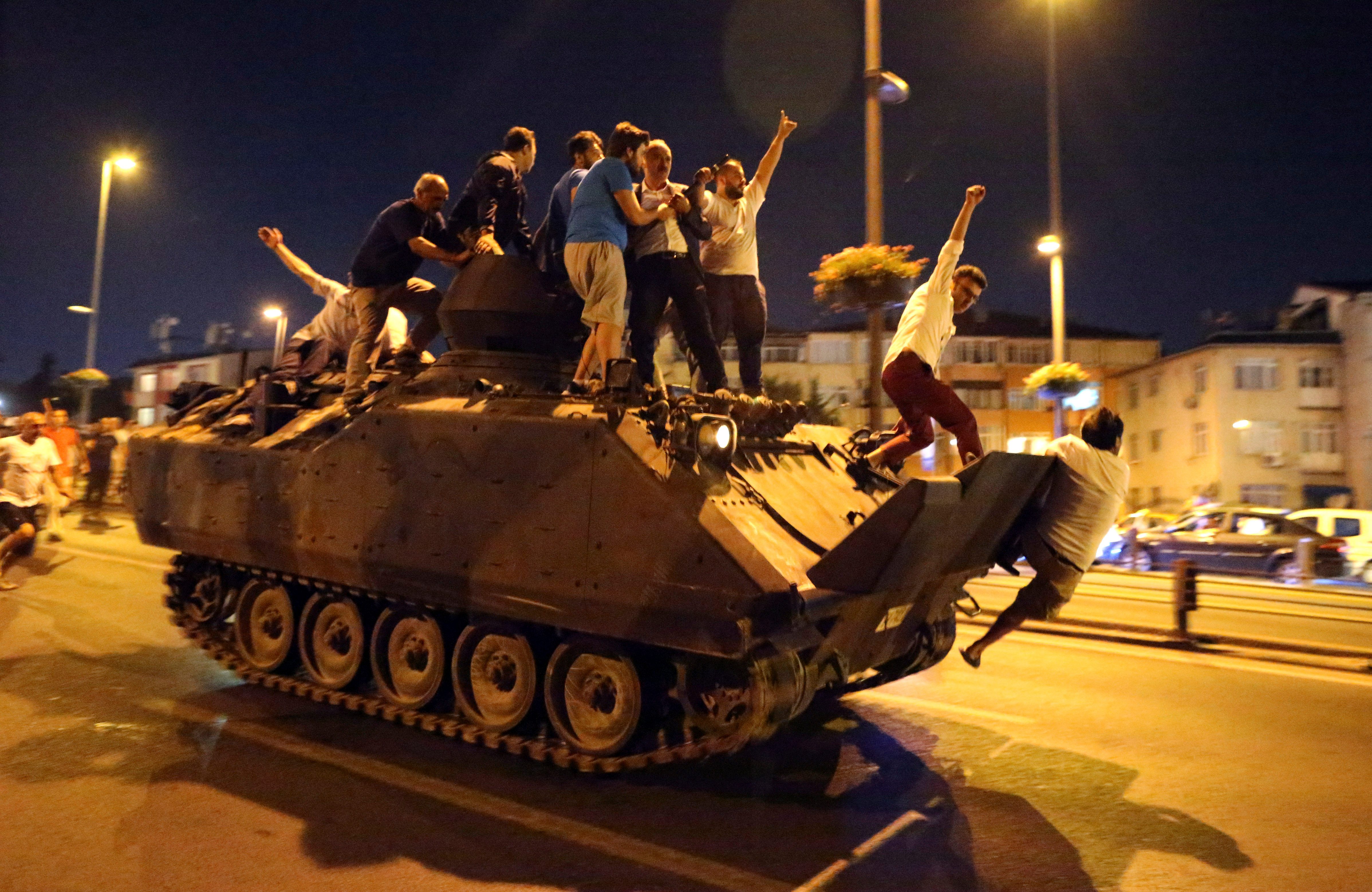 PEOPLE POWER. People occupy a tank in Istanbul on July 2016. Photo by Tolga Bozoglu/EPA  
