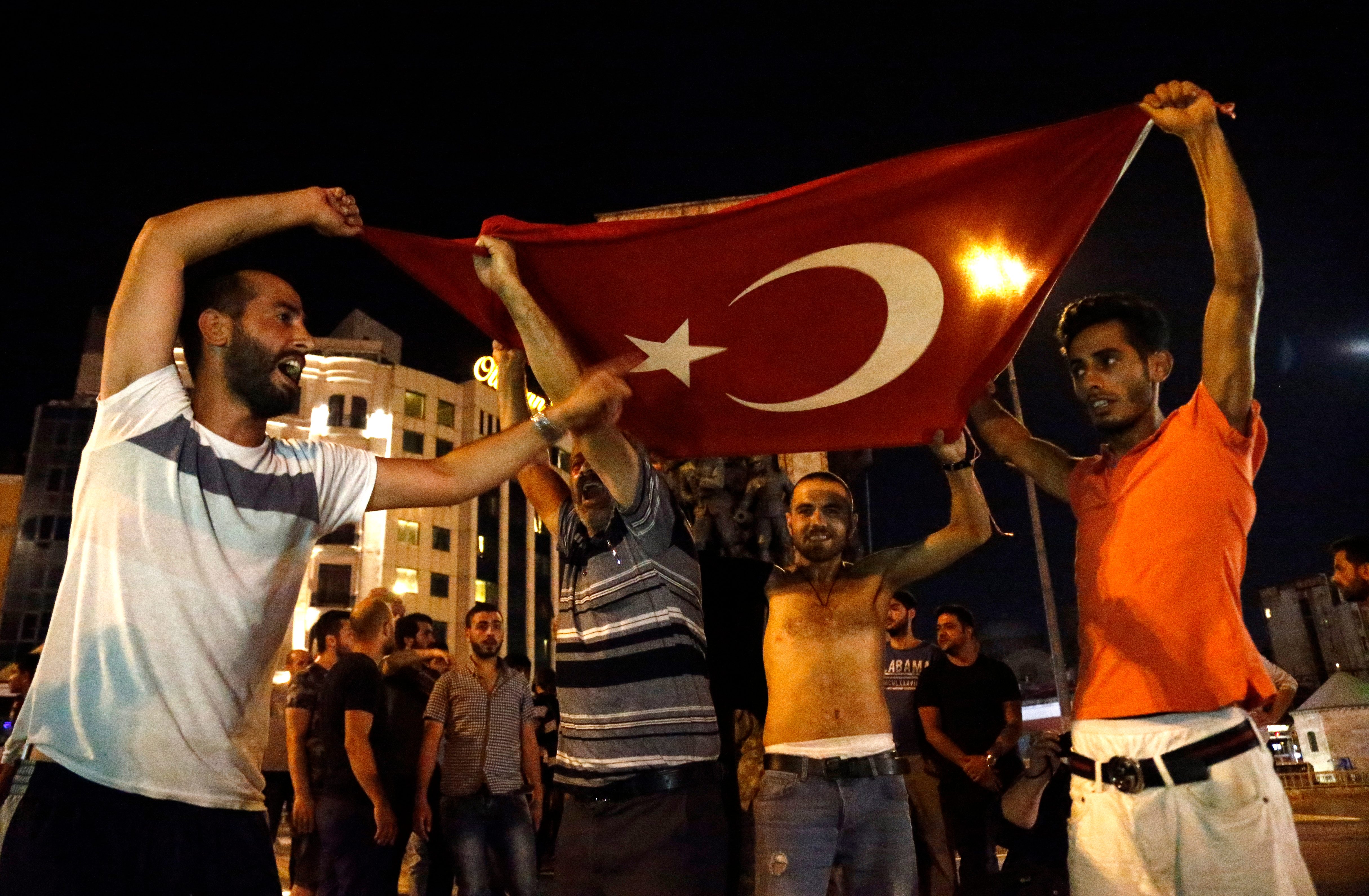 FOR ERDOGAN. Supporters of Recep Tayyip Erdogan shout slogans at the Taksim Square in Istanbul. Photo by Sedat Suna/EPA  