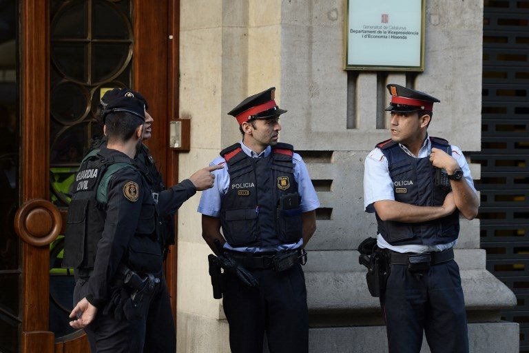 Spain police search Catalan gov’t headquarters amid referendum row