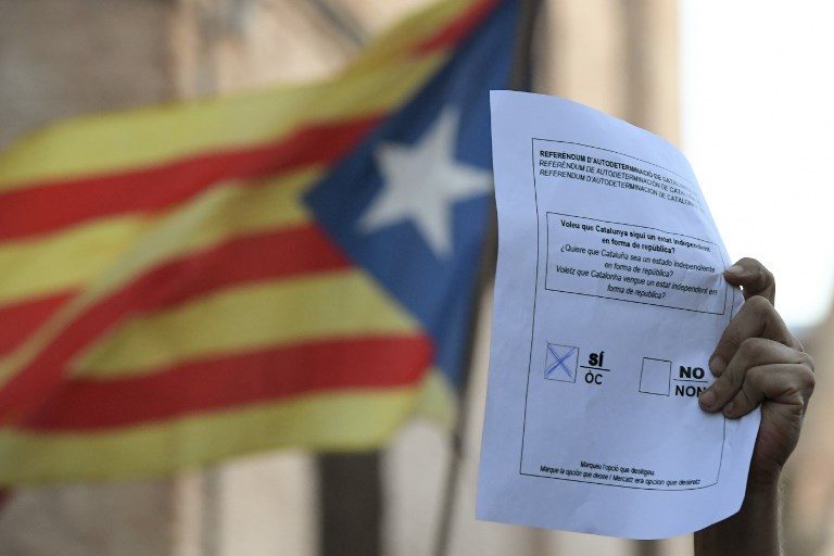 Police seal off 1,300 polling stations in Catalonia as resistance continues