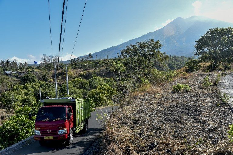 Bali volcano belches steam, sulfur as more evacuees flee