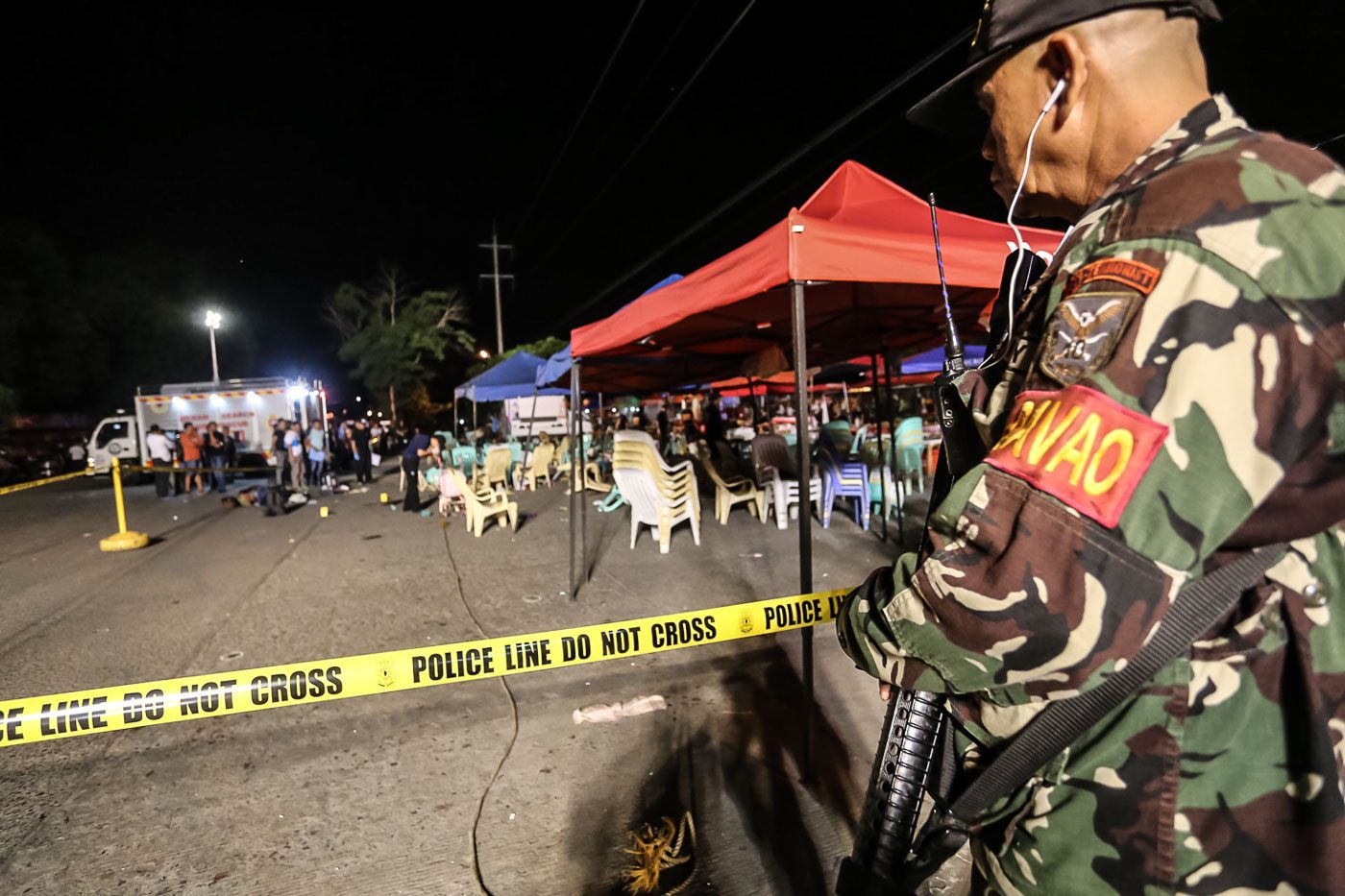 HEIGHTENED ALERT. A member of Task Force Davao secures the blast site.  