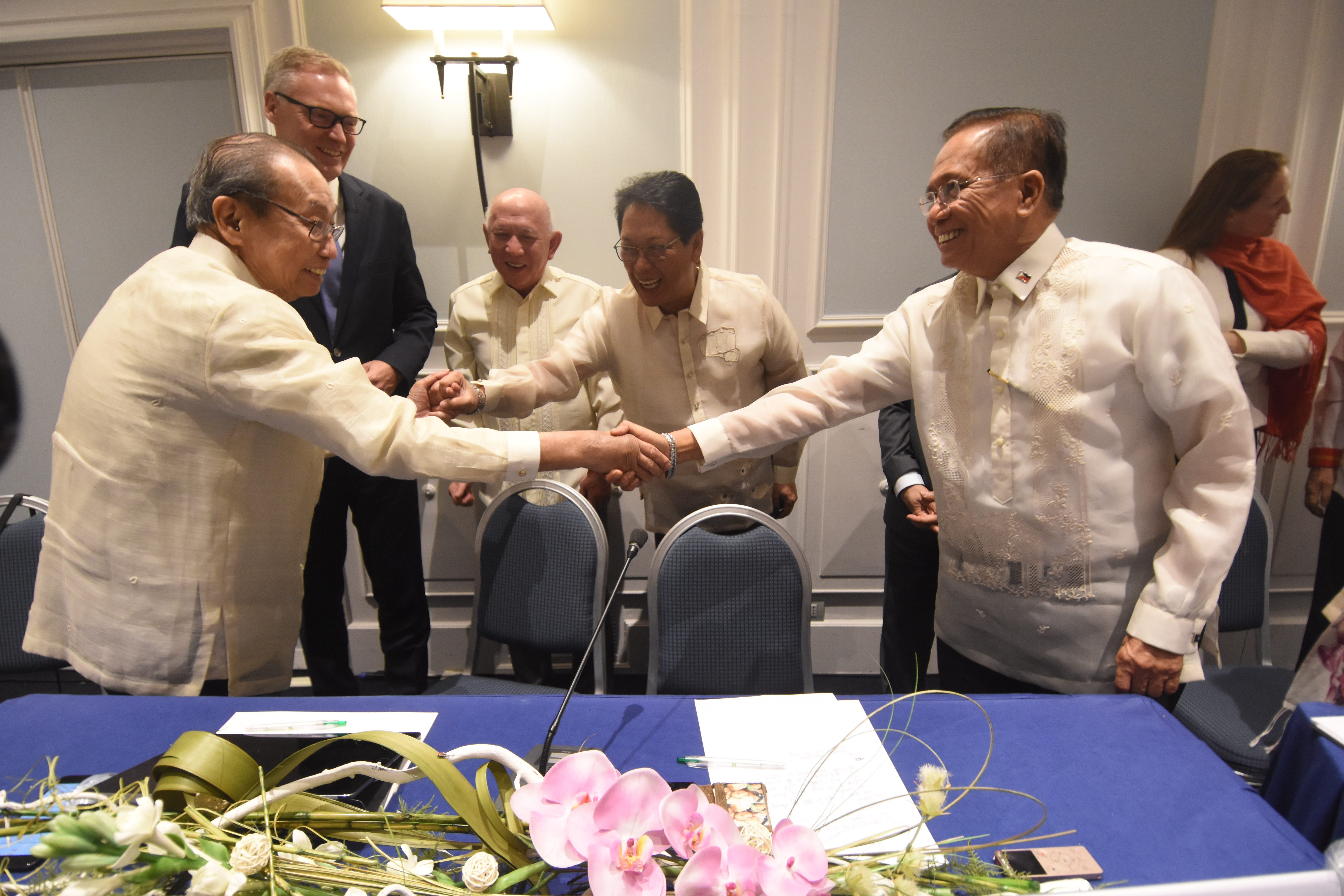 In the photo is CPP founding chair Jose Maria Sison (left) shaking hands with Presidential Adviser Jesus Dureza (right, foreground) while NDF panel chair Fidel Agcaoili (middle) and GRP chief negotiator Silvestre Bello (second from left) look on. Also in photo are Norwegian Ambassador to the Philippines Erik Forner and Special Envoy Elisabeth Slattum. OPAPP photo 