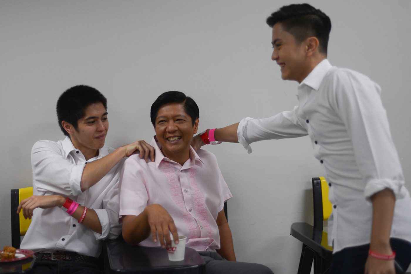 THE MEN. Senator Bongbong Marcos shares a light moment with his sons Simon and Sandro inside their holding room. Photo by Jansen Romero   