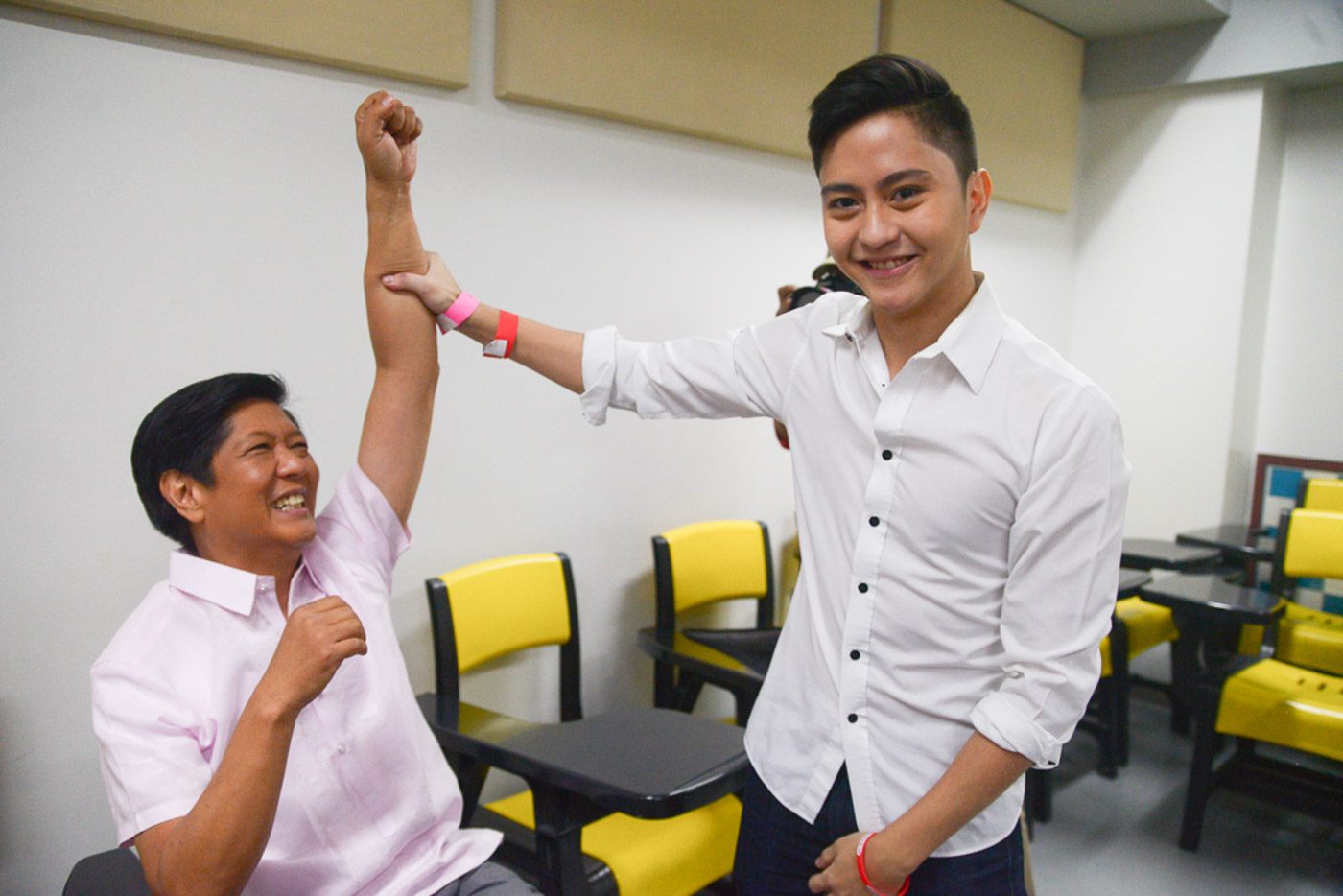 'WINNER.'  Sandro Marcos congratulates his father after the debate. Photo by Jansen Romero   