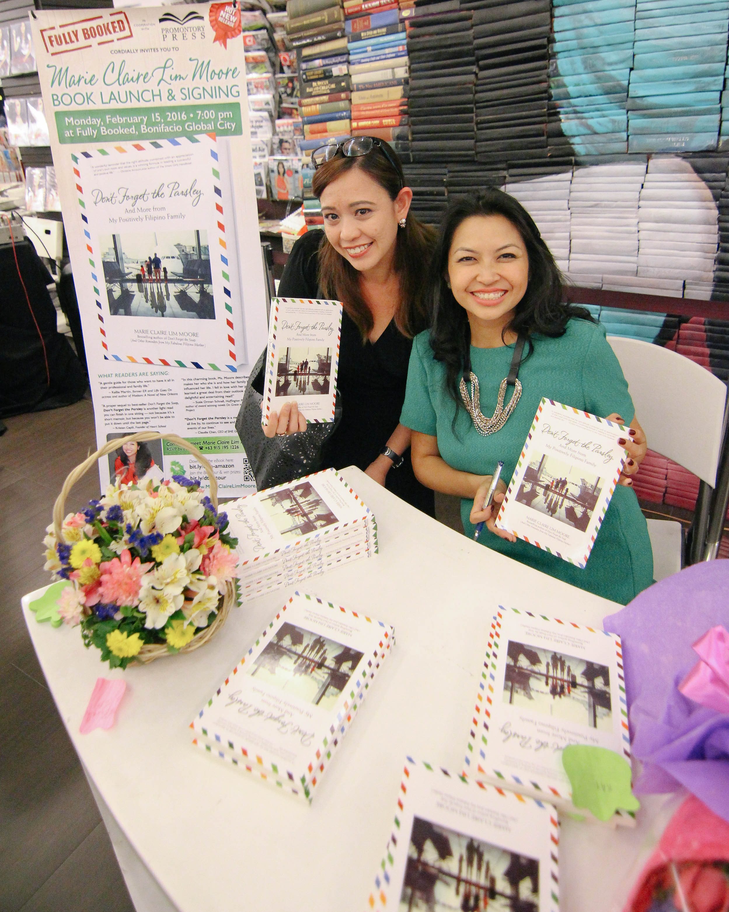 The writer, Nina Terol, with Filipino-Canadian-American author and banker Claire Lim Moore. Photo by Ena Terol  