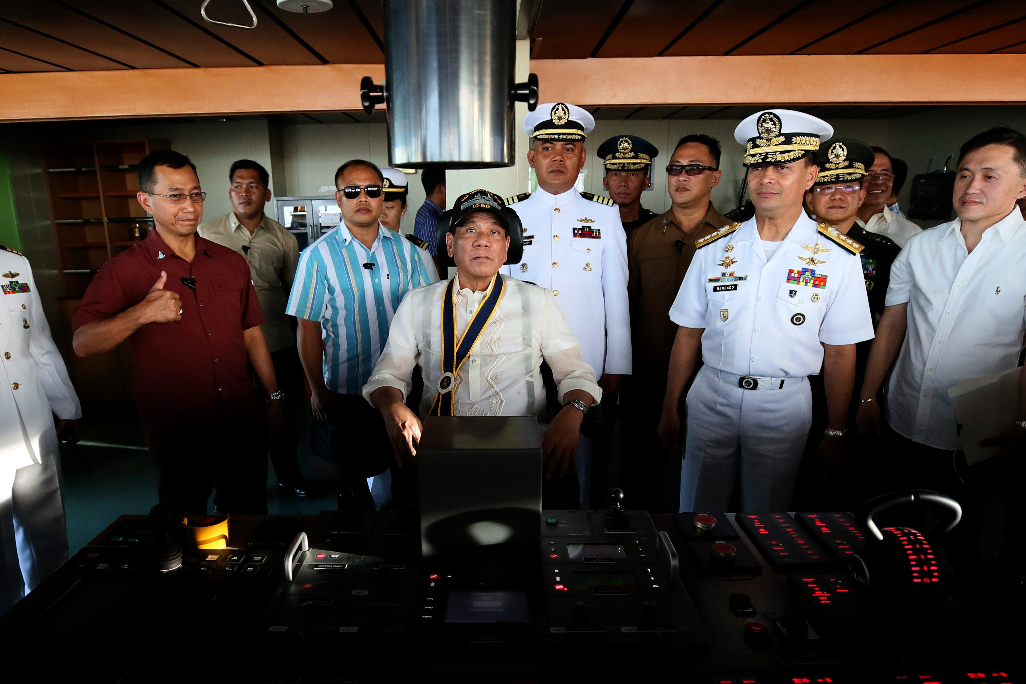 MAN AT THE HELM. President Rodrigo Duterte takes a seat at the ship's bridge during the 119th anniversary celebration of the Philippine Navy at the Sasa Wharf in Davao City on May 31, 2017. Malacañang photo   