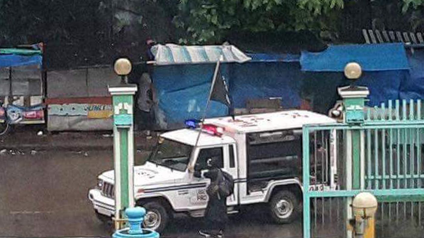 POLICE CAR? Another ISIS black flag is seen atop what appears to be a police car taken by the Maute Group. Photo by Chico Dimaro Usman   