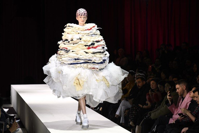 FALL/WINTER COLLECTION. A model presents a creation for Comme des Garcons during the 2018/2019 fall/winter collection fashion show on March 3, 2018, in Paris. Photo by Bertrand Guay/AFP  