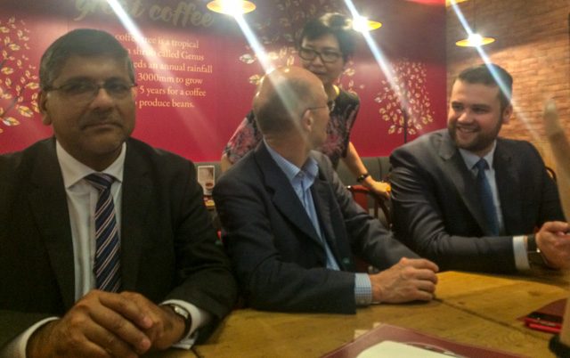 POWERHOUSE. Costa Coffee International managing director Christopher Rogers (2nd from left, seated) chats with Robinsons Retail COO and president Robina Gokongwei-Pe (standing). They are flanked by Asif Ahmad, British Ambassador to the Philippines (extreme left), and Matt Kenley, the coffee chain's international operations manager for Southeast Asia and India. 