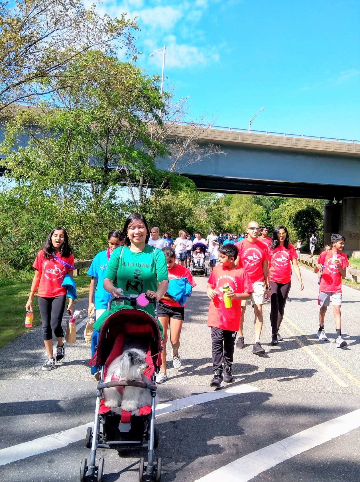 MEMBERS of Team Diego, with their mascot Tatiana the dog on board Diego’s stroller, finish the 5-kilometer Walk N’ Roll in New Jersery on September 15, 2019, in memory of Diego Lumauig. Photo by Georgina Lumauig 