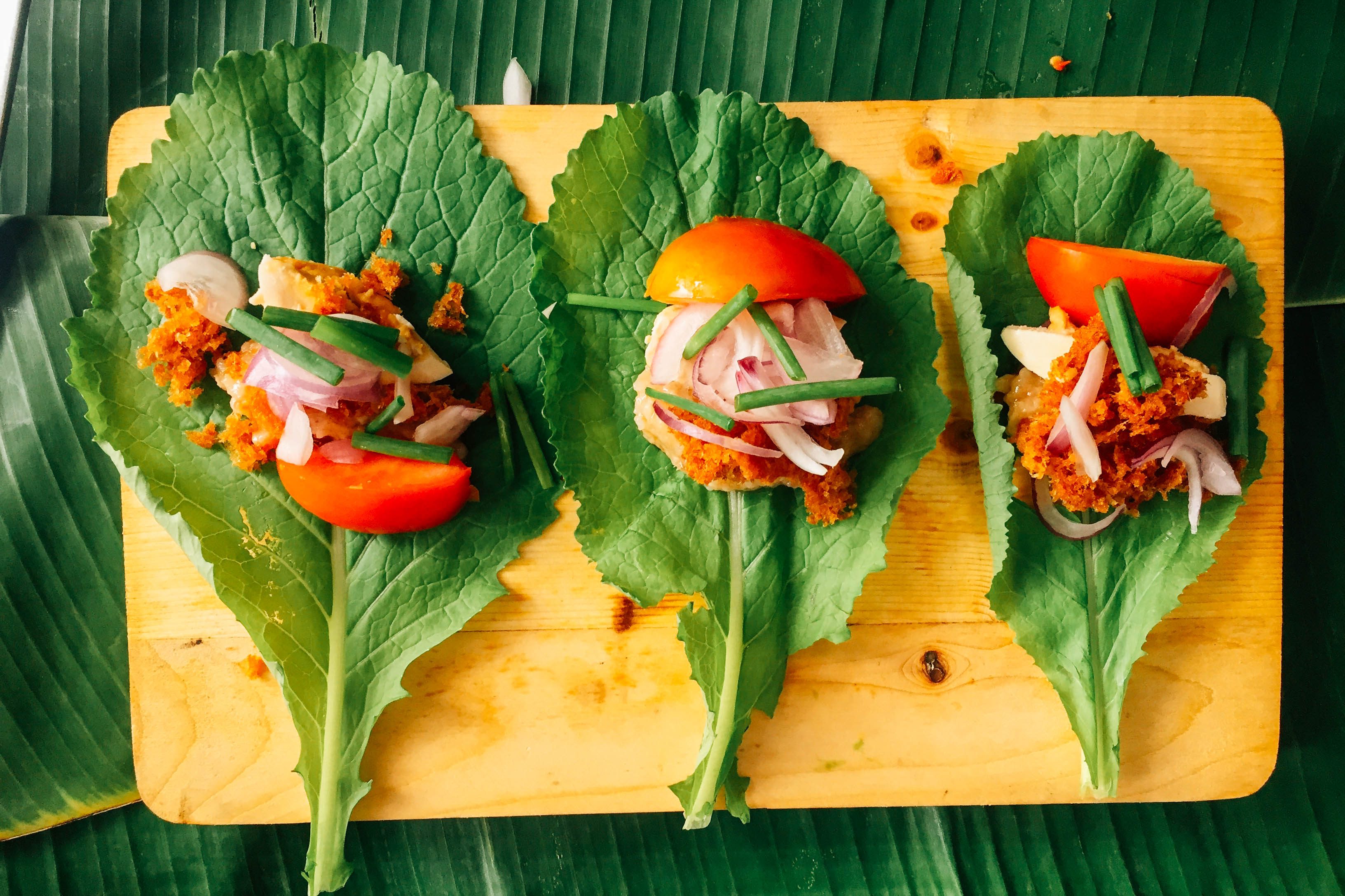 BURO AND HITO. Fermented rice and catfish rolled up in mustard leaves – chef Sau del Rosario suggests rolling these up like sushi and eating them with your hands. Photo by Vernise L. Tantuco  