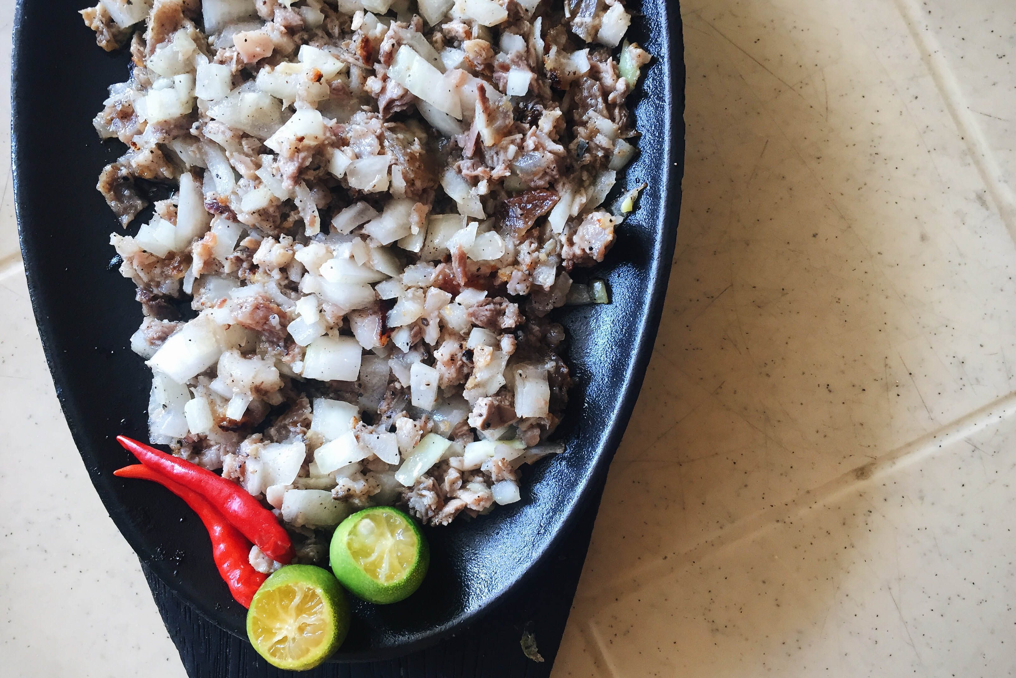 ALING LUCING'S SISIG. Rumor has it that Aling Lucing's sisig was so good was murdered for secret sisig recipe. Photo by Vernise L. Tantuco  
