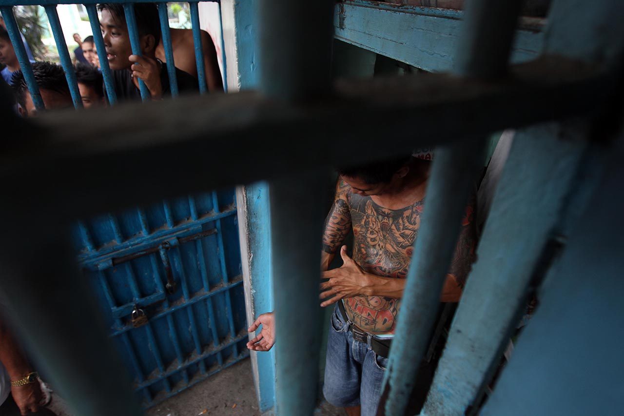 In this file photo, Filipino inmate shows his tattoo inside a crowded cell in New Bilibid Prison, Muntinlupa City, south of Manila, Philippines, 17 July 2012. Photo by Dennis Sabangan/EPA 