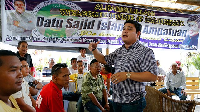 BAIL. Sajid Islam Ampatuan, son of former Maguindanao governor Andal Ampatuan Sr (extreme right) who was granted bail on January this year, speaks to their family's supporters upon his return to Cotabato City, May 10, 2015, after 5 years in prison.
  