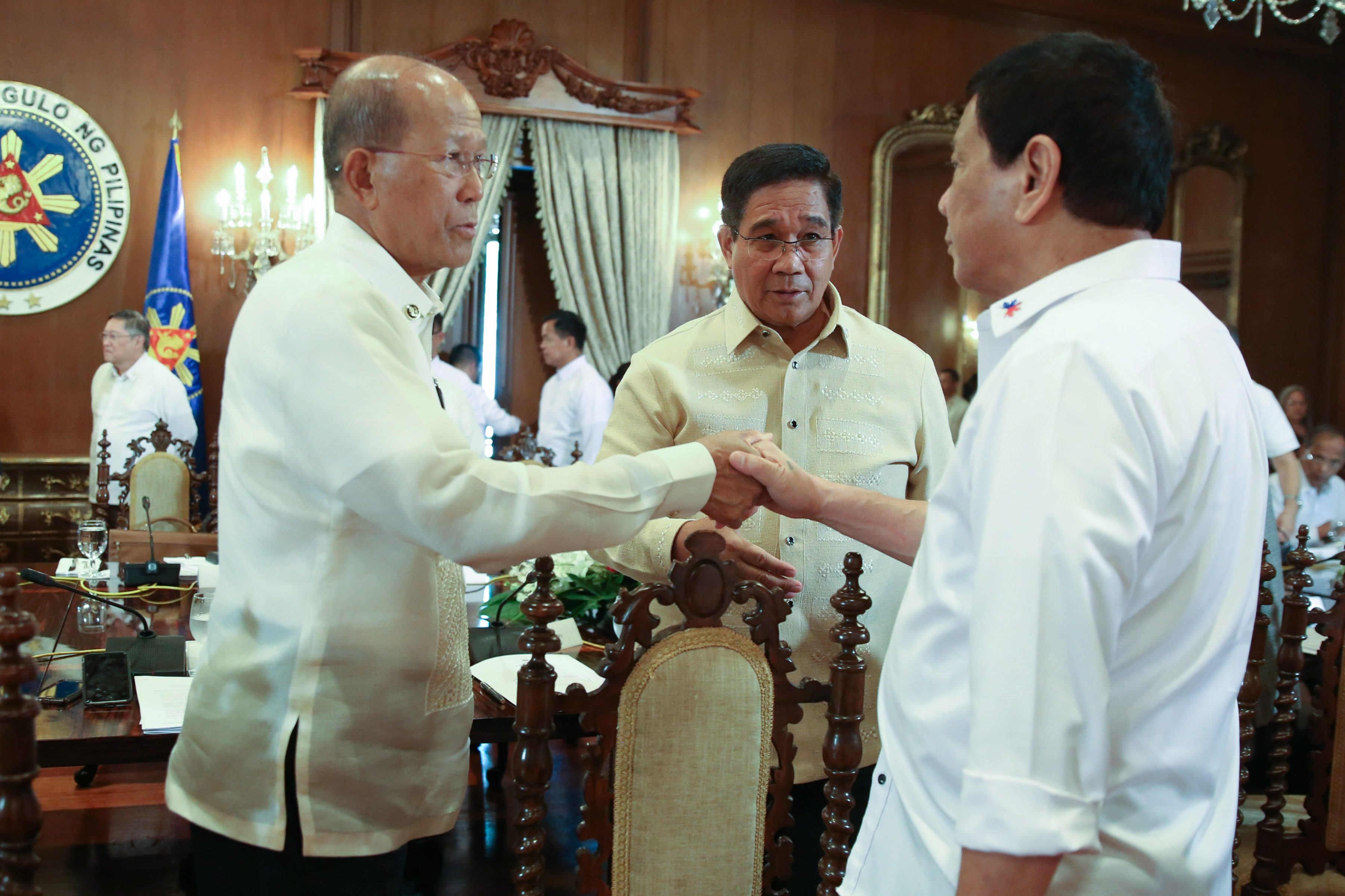 SECURITY ADVISERS. President Rodrigo Duterte is greeted by Secretary of National Defense Secretary Delfin Lorenzana and National Security Adviser Hermogenes Esperon Jr upon his arrival for the 13th Cabinet Meeting. Malacañang photo 